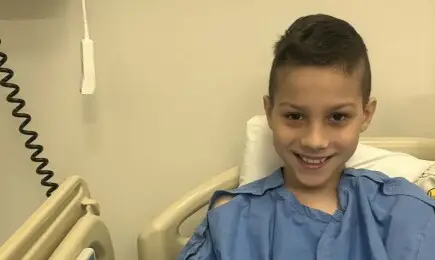 family photos of a child cancer survivor supported by a successful fundraising campaign